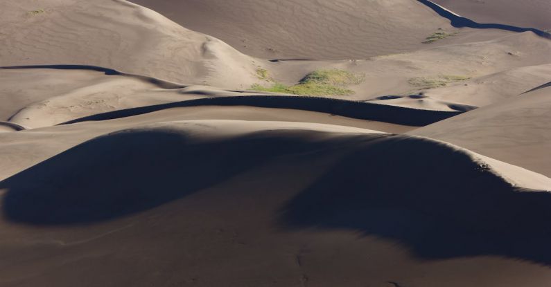 Adventure Travel - A tent is set up on the sand dunes