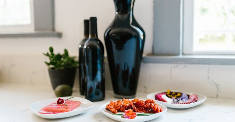 One-pot Meals - Three Dishes in front of Vase and Bottles