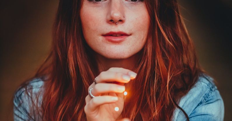 Evening Makeup - Woman in Blue Denim Jacket Holding String Lights