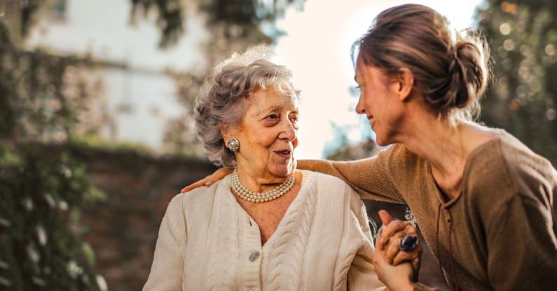 Family Meetings - Joyful adult daughter greeting happy surprised senior mother in garden