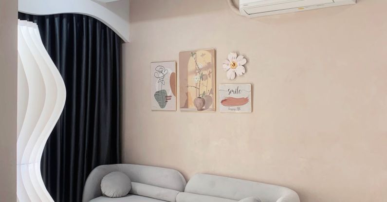 Cozy Living - A living room with a white couch and air conditioning