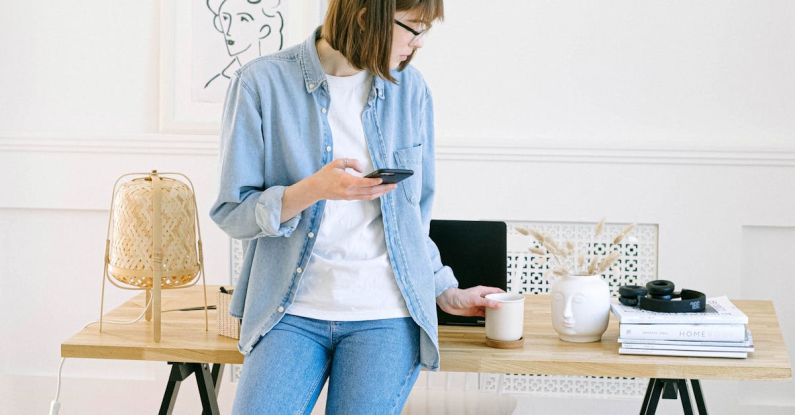 Remote Work - Woman Leaning Against Desk in Home Office
