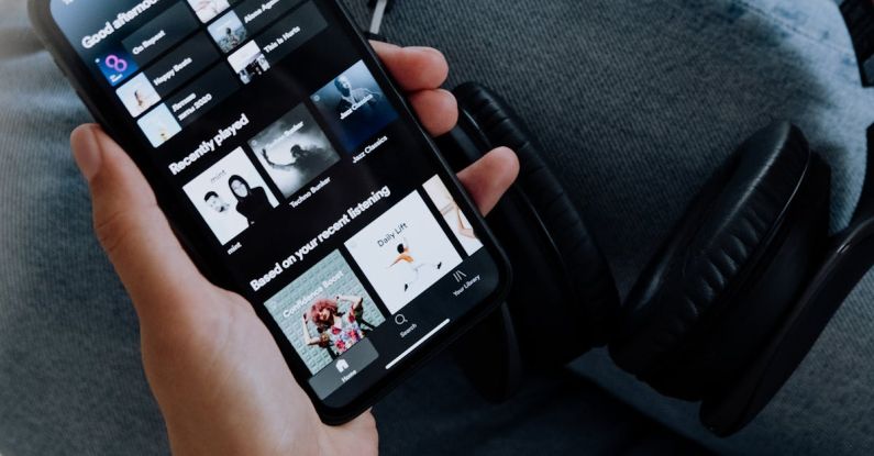 Smartphone Choice - Person Using Spotify on an Iphone