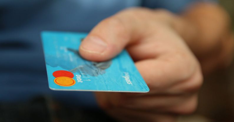 Reduce Debt - Person Holding Debit Card