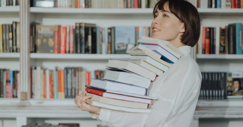 Smart Shopping - Woman in White Long Sleeve Shirt Reading Books