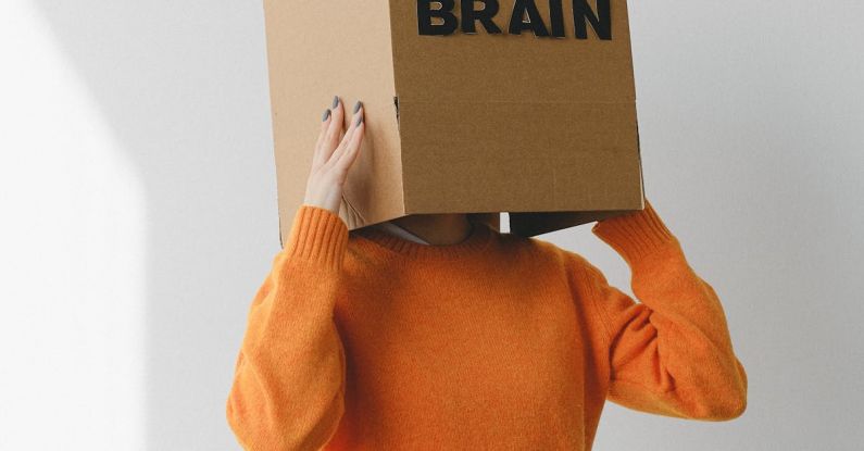 Understanding Taxes - Crop person putting Idea title in cardboard box with Brain inscription on head of female on light background