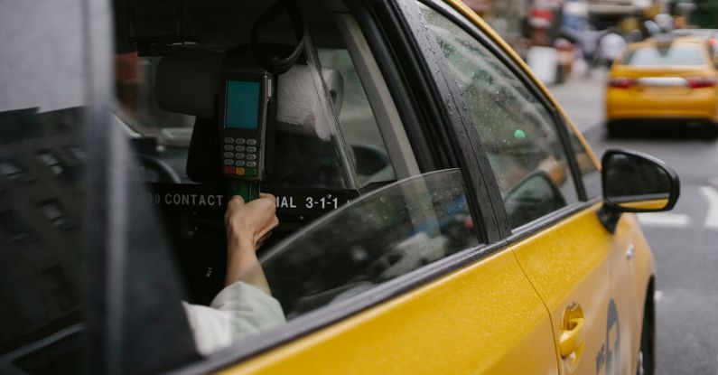 Credit Card - Anonymous person paying for taxi ride by credit card